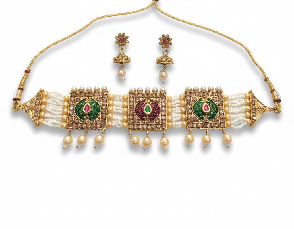 Gold, green, and white jewelry set with necklace and earrings on a white background